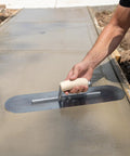 Using Pool Trowel With 20 Inch Blue Steel Blade Flexible For Radius Finishes on wet concrete surface