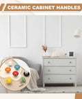 Room with dresser and selection of ceramic cabinet handles, including Two Pack Ceramic Cabinet Knobs 1.4 Inch Round Drawer Pulls