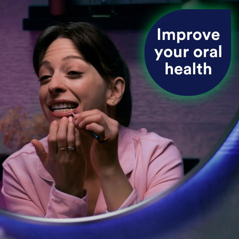 Using Professional At Home Oral Care Kit With Mirror, Dental Pick, Scaler And Stimulator for fresh breath in front of mirror