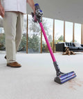 Person using Quick Release Vacuum Attachment Motorhead For Cordless Cleaners, No Fuss Easy Fit For V6 Series on carpet