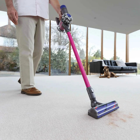 Person using Quick Release Vacuum Attachment Motorhead For Cordless Cleaners, No Fuss Easy Fit For V6 Series on carpet