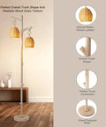 68 Inch Farmhouse Floor Lamp With Tree Trunk Faux Wood Column And White Washed Wicker Drum Shade shown in rustic setting
