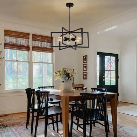 Drop-Dead Gorgeous 23.6 Inch Black Farmhouse Chandelier With Six Lights And Fully Adjustable Drop For Kitchen Table Dining Room Or Foyer illuminating a dining table.