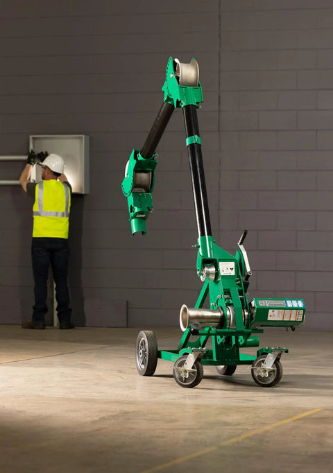 Greenlee 10k Tugger Package Featuring Dual Speed Motor For Faster Pulls, with mobile tow rig on job site.