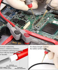 Pro Grade 25 Piece Multimeter Leads Kit With Replaceable Gold Plated Probes testing electronics on a circuit board