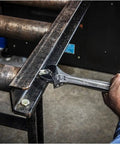 Using Six Inch Adjustable Wrench With Bagged Packaging, Hex Jaw Design for slip-free gripping on metal fastener in the garage.