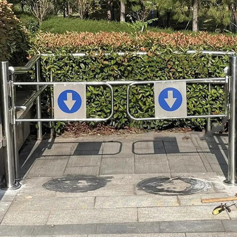 Top Shelf Hella Durable Industrial Metal Swing Gate With Slick Silver Finish For Secure Warehouse And Retail Entry Featuring Quick Install Hardware And Decor Covers - view of gate installed outdoors with directional signs.