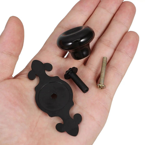 Vintage Ceramic Cabinet Knobs With Matte Black Finish For Retro Wardrobe Drawers And Kitchen Cupboard Hardware No Fuss Easy Grip Ergonomic Porcelain Knobs Durable Build For Everyday Use in hand showing knob, backplate and screws