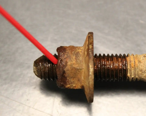 Close-up of rusted bolt treated with Green Wonder 300 Ml Plant Based Aerosol Cleaner And Lubricant For Doors Locks Hinges Chains And Valves