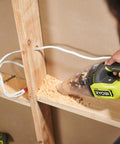 Compact 18V Lithium Ion Handheld Vacuum With Beast Mode Suction Power And Double Mesh Filtration Setup in use cleaning wood shavings.