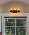 Three Light Dope Vintage Wood Wall Mount Sconce With Bubble Glass Shade above window, Edison Style E26 bulbs lit.