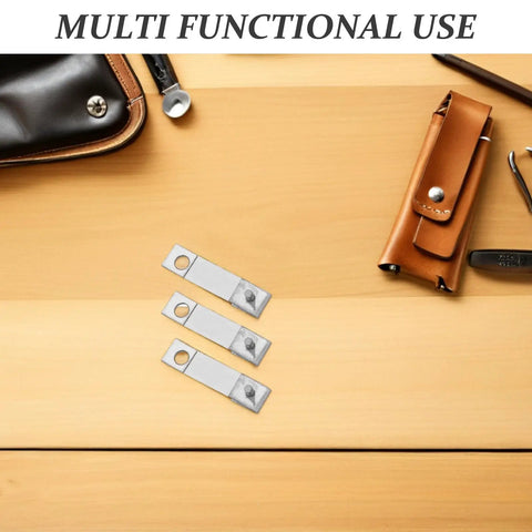 Three Six Pack Mechanical Clock Suspension Springs Universal 17mm Replacement Parts on wooden surface with leather case nearby.