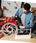 Top Shelf Front And Rear Disc Brake Rotor Kit For Mountain Bikes With Silver Aluminum Build 160mm Diameter showing installation.
