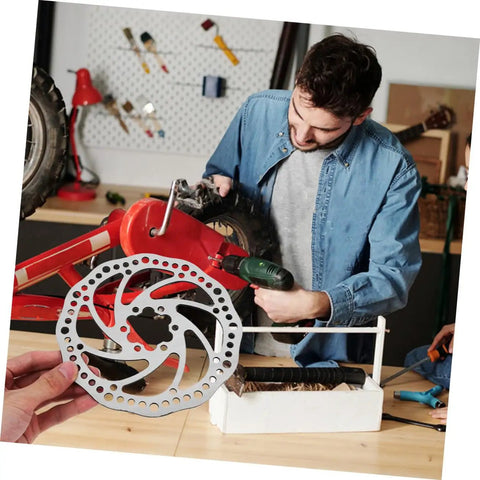 Top Shelf Front And Rear Disc Brake Rotor Kit For Mountain Bikes With Silver Aluminum Build 160mm Diameter showing installation.