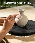 Bulk 6 Pack Of Slick 12 Inch Black Lazy Susan Turntables For Pantry Cabinet Organization Featuring Smooth 360 Spin Heavy Duty Plastic Rotating Trays being used to paint a vase.