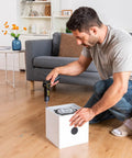 High Performance Pivot Handle Electric Screwdriver Featuring Live Torque Display And Eight Adjustable Settings For Hustle Ready Tech Repairs And Smooth Jobs being used by man on white box fan.