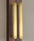 Four Pack Three Point Eight Inch Coffee Antique Brass Cabinet Pulls Handles, installed on wooden cupboard