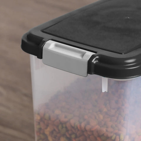 Close-up of Air Tight Pet Food Storage Bin With Wheels Makes Kibble Management A No Brainer Holds 22 To 26 Lbs Of Dry Kibble 33 Quart Container For Dog Cat Bird Food BPA Free Easy Roll Mobility Keeps Fresh Black focus on latch.