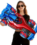 Remote control monster truck toy, red and blue body, 1:12 scale with lights; held by a woman wearing sunglasses
