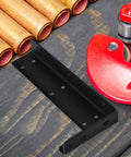 Black iron floating shelf bracket beside copper pipes and red tool, showcasing Floating Shelf Brackets Invisible Installation No Fuss Two Pack