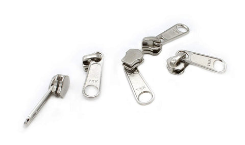 Zip Repair Kit With Metal Aluminum Sliders And Top And Bottom Stops, Assorted Sizes 3, 4.5, 5, And 10 displayed on white surface