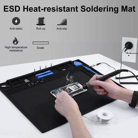 Person using Premium Pro Grade ESD Safe Soldering Mat Kit With Wrist Strap And Grounding Plug For Electronics Repair at a workstation.
