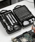 Person using All In One Precision Screwdriver Set With Magnetic Bits And Storage Case, 115 In 1 Tool Kit for electronics repair