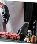 Heavy Duty Cut Resistant Arm Sleeves For Welding And Yard Work shield forearms while cutting meat with gloves and a knife.