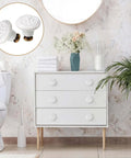 White Ceramic Cabinet Knobs Set With 12 Dope Retro Round Dresser Pulls on a white dresser in a modern bathroom setting