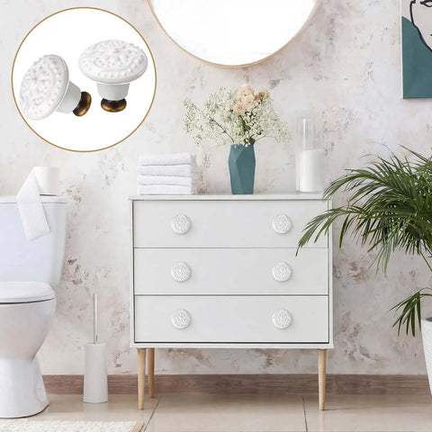 White Ceramic Cabinet Knobs Set With 12 Dope Retro Round Dresser Pulls on a white dresser in a modern bathroom setting