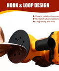 Close-up of orange cordless random orbital sander with 5-inch black hook-and-loop sanding disc