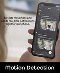 Hand holding smartphone showing Freebird 2K Wireless Security Camera Battery Powered Outdoor Camera Motion Detection alerts.