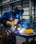Welder using Aluminum Welding Rods E4043 Alloy For One Eighth Inch By Fourteen Inch Stick Electrodes in workshop