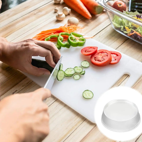 Person slicing cucumbers on a cutting board with vegetables around, featuring 24 Pack Clear Self Adhesive Rubber Feet For Glass Tables And Drawers Rock Solid Anti Slip Bumpers Total Lockdown Grip Zero Drama Slide Super Tight Peel Stick Setup.
