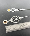 Close-up of Brass Clock Hands Replacement Kit For 7 Inch Dial NOS DIY Clock Assembly with ruler for scale
