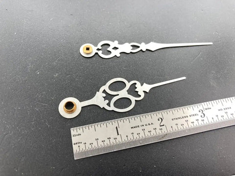 Close-up of Brass Clock Hands Replacement Kit For 7 Inch Dial NOS DIY Clock Assembly with ruler for scale