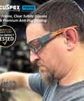Kick Ass Full Frame Clear Safety Glasses With Smooth Sporty Fit And Badass 99 Point 9 Percent Uv Shielding For Serious Eye Coverage And All Day Grind Comfort In A 144 Pair Bulk Pack worn by a man during work.