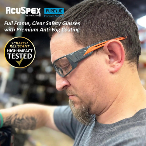 Kick Ass Full Frame Clear Safety Glasses With Smooth Sporty Fit And Badass 99 Point 9 Percent Uv Shielding For Serious Eye Coverage And All Day Grind Comfort In A 144 Pair Bulk Pack worn by a man during work.