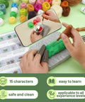 Hands using 15 Piece Beginner Friendly Succulent Needle Felting Kit With Wool Roving, Felting Mat, Needles, And Step By Step Instructions