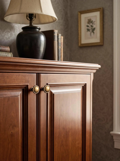 Top Shelf Antique Brass Cabinet Knobs Six Pack Round Single Hole Kitchen Furniture Hardware Easy DIY Install Vintage Inspired Aged Brass Finish on wooden cabinet.