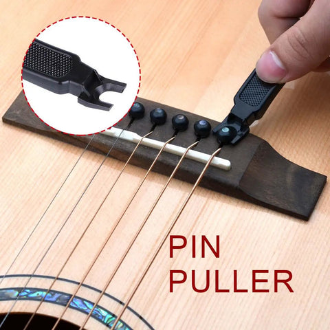Saphue 3 In 1 Multifunction Guitar String Winder Cutter Pin Puller For Bass And Banjo showing pin puller in use on guitar bridge.