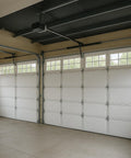 Interior of a garage with Thick 5mm Foam Core Insulation Roll 48 Inch By 50 Feet Reflective Radiant Barrier installed on doors.