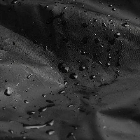 Close-up of Waterproof Outdoor Stackable Chair Cover for Patio Chairs 210D Heavy Duty Fabric with water droplets, black color