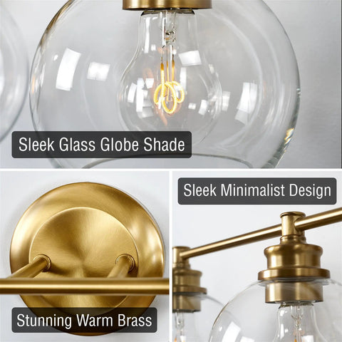 Close-up of 22 Inch Modern Three Light Vanity Bathroom Light With Clear Glass Globe Shades And Warm Brass Finish