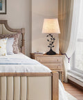 Vintage Tree Branch Base Table Lamp With Beige Shade USB A And USB C Charging Ports in a stylish bedroom setting