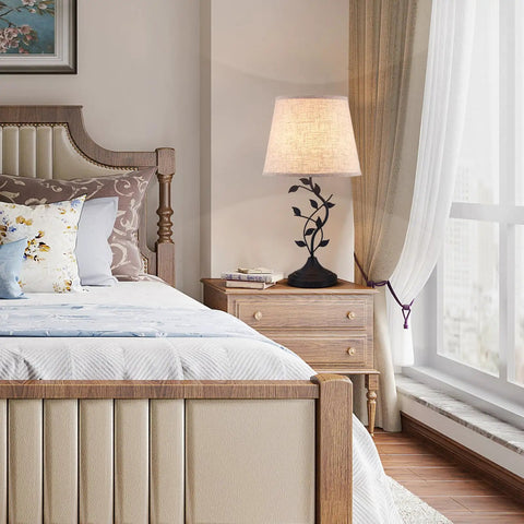 Vintage Tree Branch Base Table Lamp With Beige Shade USB A And USB C Charging Ports in a stylish bedroom setting