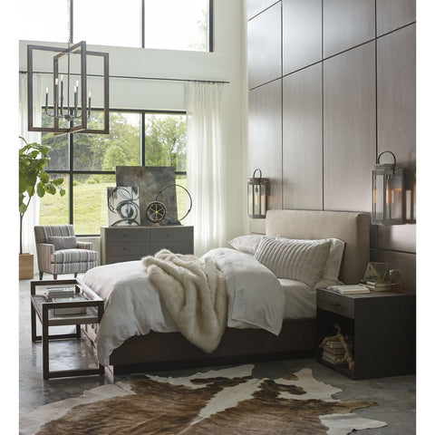 Modern bedroom with large windows, featuring a cowhide rug and two Union Square Collection 1-Light Outdoor Wall Lanterns on the walls.