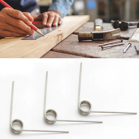 10 Pack Small Stainless Steel Torsion Springs 50mm Long 1.2mm Thick 11.4mm OD With 5 Turns And 120 Degree Rotation shown on a table