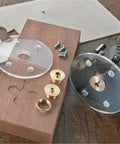 Premium Pure Copper Router Bushing Guide Set Dead Nuts Precise For Fine Woodworking components on wood, including brass bushings and screws.