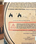 Warning labels on XL Portable Campfire On The Go For Camping Beach And Patio With Eucalyptus Scent Tabletop Fire Pit
